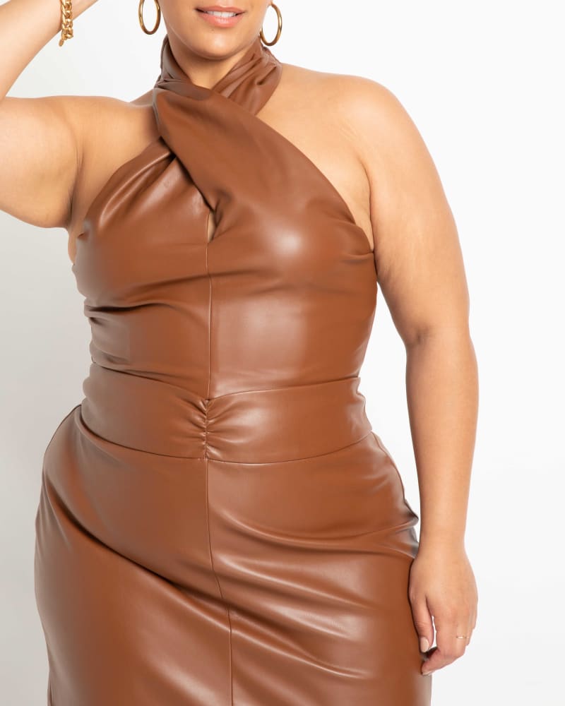 Front of a model wearing a size 14 Ada Faux Leather Crossover Halter in Sorrel Horse by ELOQUII. | dia_product_style_image_id:236429